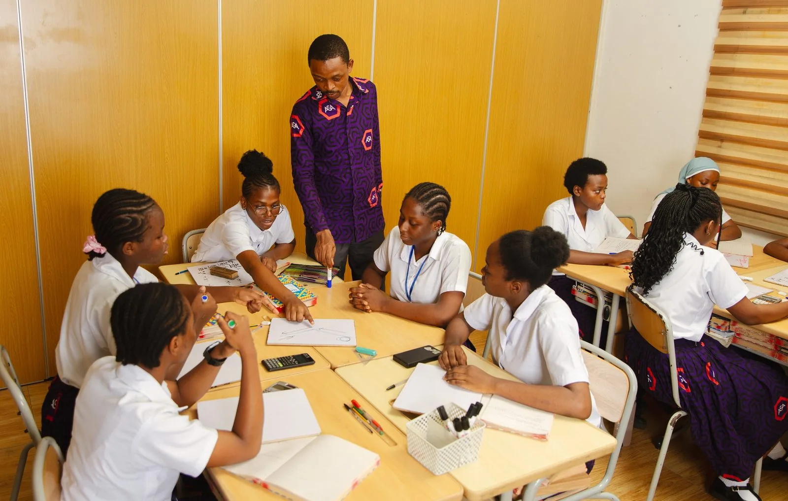 ASA students focused during a classroom lecture with laptops