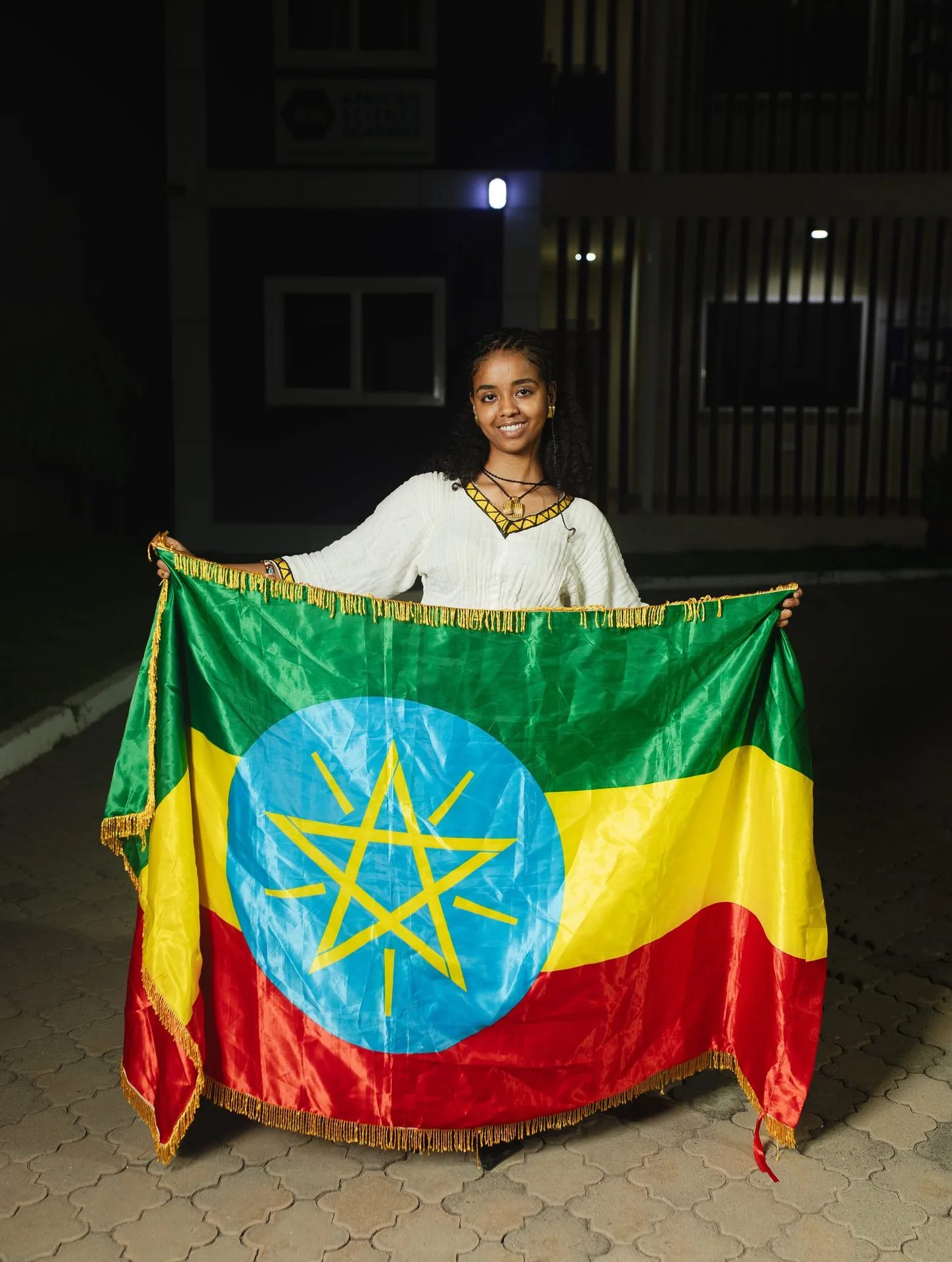 An ASA student from Ethiopia with her national flag