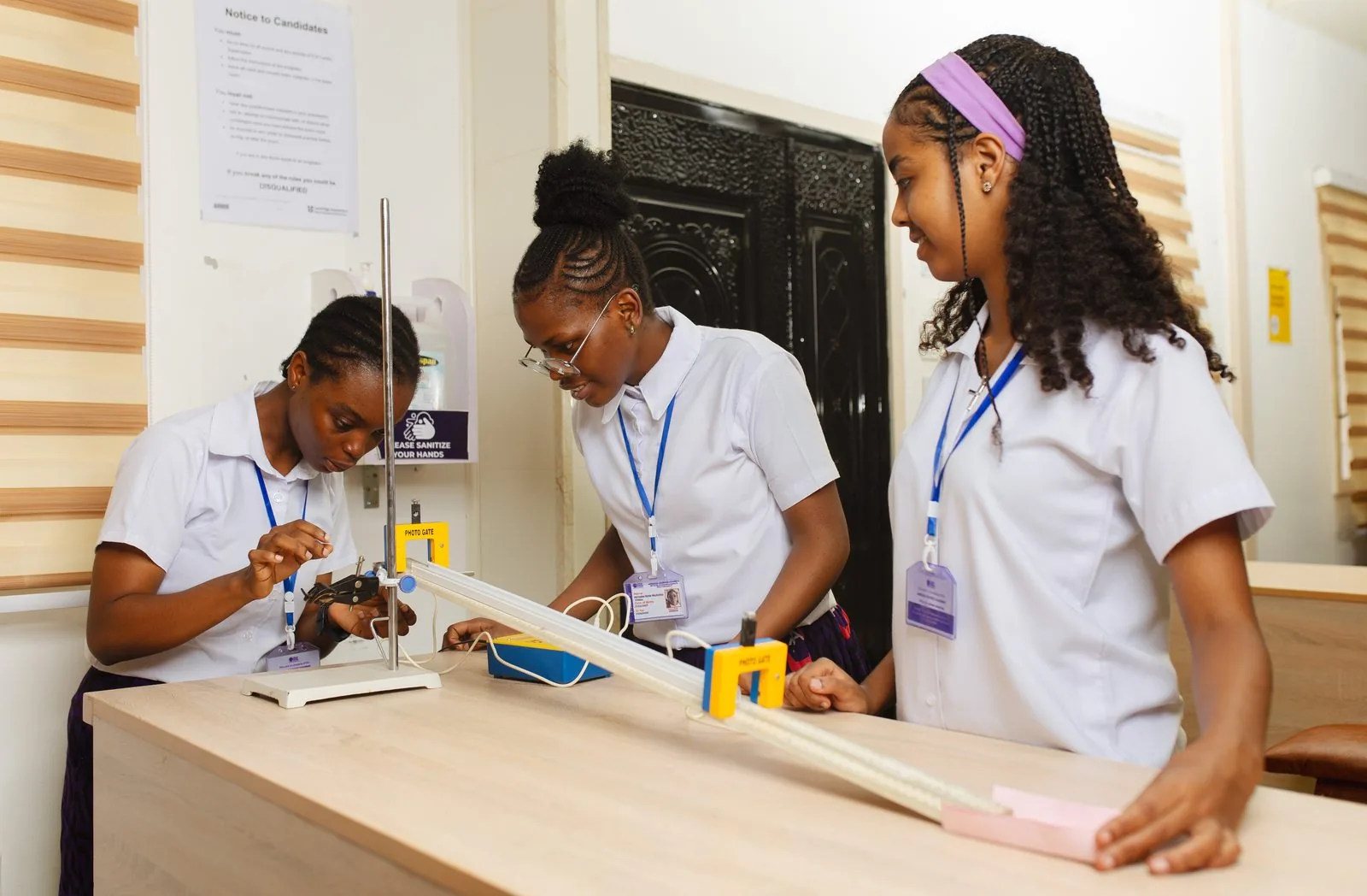 ASA students conducting a physics experiment with a photo gate