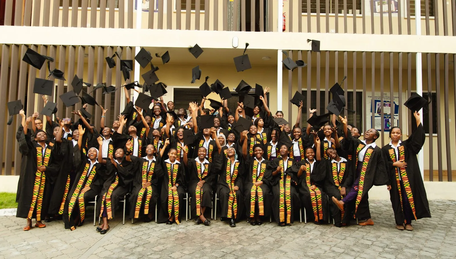 An entire ASA graduating class throwing their caps in celebration