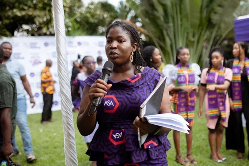 ASA staff member addressing students and guests at an outdoor event