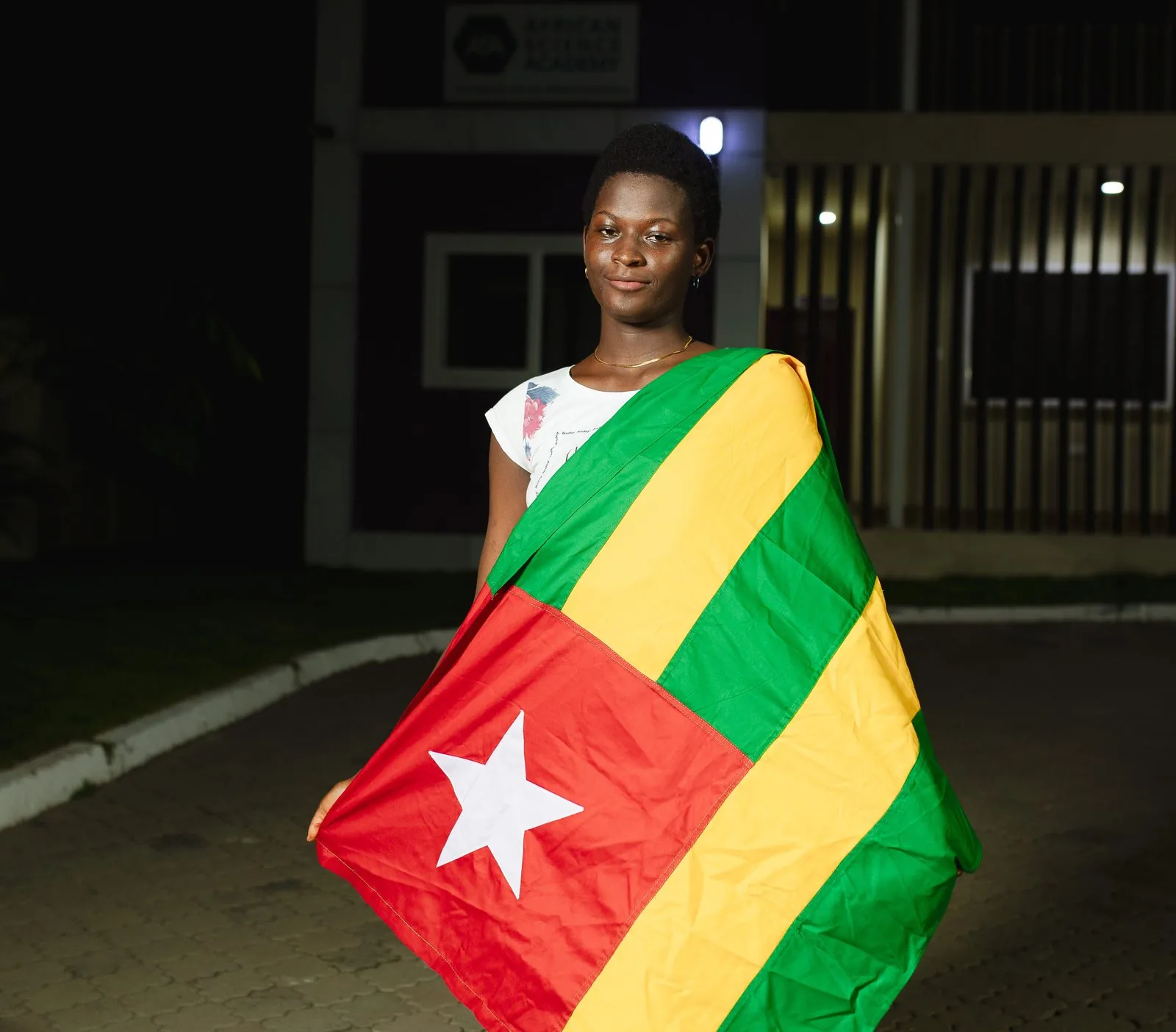 An ASA student from Togo with her national flag